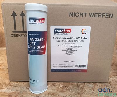 un bidon de liquide posé à côté d'une boîte en carton