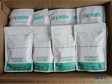 six bags of mystery future coffee sit in a cardboard box