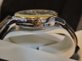 a watch that is sitting on top of a white plate