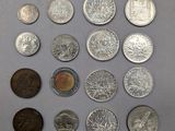 a lot of coins that are on the table