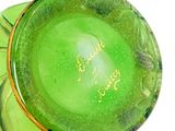a green glass vase with a gold rim on a white surface