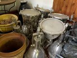 many pots and pans sitting on the floor