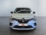 the front view of a white car in a showroom