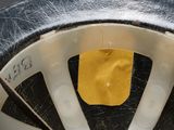 a close up of a bicycle wheel with a sticker on it