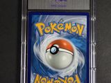 a close up of a pokemon card in a plastic case