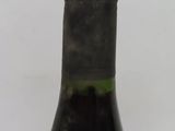 a bottle of wine that is sitting on a table