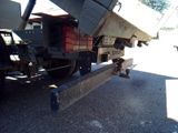 a dump truck that is parked on the side of the road