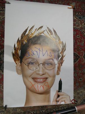 a poster with a picture of a woman with a crown on it