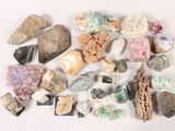 a pile of rocks and stones on a white surface