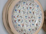 many plates and bowls arranged on the wall