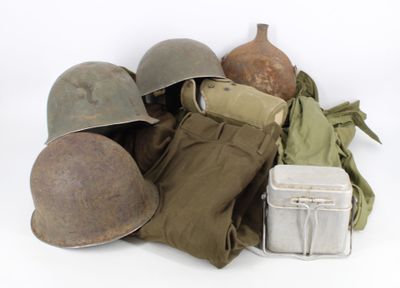 a pile of military items on a white surface