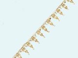 a close up of a gold chain with a bunch of beads on it