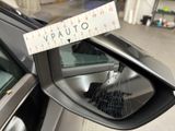a sticker on the side view mirror of a car