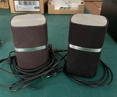 two speakers that are sitting on a table
