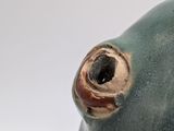 a close up picture of a ceramic sculpture of a fish