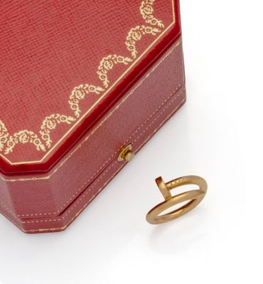 a red box with a gold ring inside of it