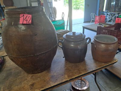 a table with a lot of pots and pans on it