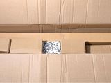 a cardboard box that has a bunch of items inside of it