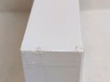 a close up of a piece of wood with a white paint