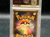 a close up of a pokemon card in a clear plastic holder