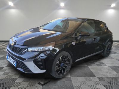 a black car parked on a checkered floor in a garage