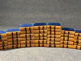many stacks of books stacked on top of each other