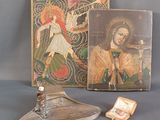 a picture of a book and a candle holder on a table