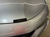 a close up of a car ' s hood with a sticker on it