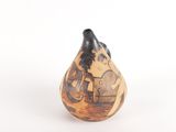 a small vase that has a picture of a boat on it