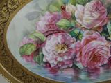 a picture of a painting of pink roses on a plate