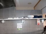 a kitchen with a stove, sink, and dishwasher in it