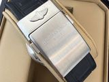 a silver and black watch inside of a black case