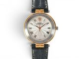 a close up of a wrist watch with roman numerals on it