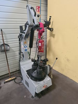 a machine that is sitting in a garage next to a wall