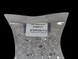 a bag of diamonds in a plastic bag on a black background