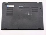 a black laptop with a blue sticker on the back of it
