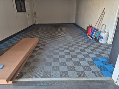 a picture of a room with a checkered floor and a bench