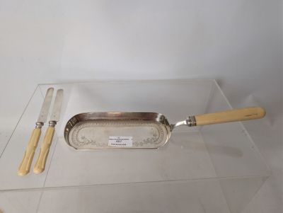 a silver tray with a knife, fork and spoon on it