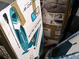 a pile of boxes sitting on the floor in a room
