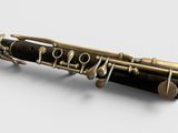 a close up of a flute on a white surface with a white background