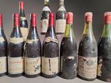 several bottles of wine are lined up in a row on a table