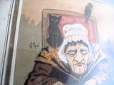 un tableau représentant une vieille femme avec un chat assis sur ses genoux