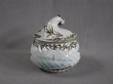 a white and blue bowl with a wave on it