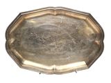 silver plate on a stand on a white background with a white background