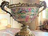 a large ornate bowl sitting on a table in a room