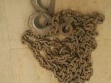 a lot of chains and a pair of scissors on the floor