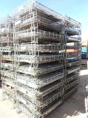 a large pile of cages stacked on top of each other