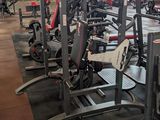 a gym with a lot of machines in the room