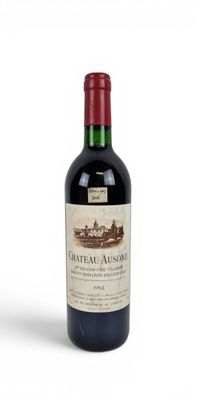 bottle of chateau ausois wine on a white background