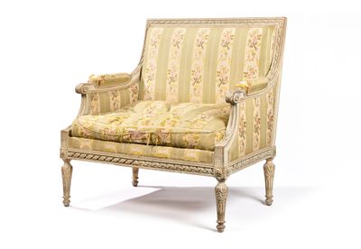 une image d'une chaise avec un dossier rembourré à motifs floraux